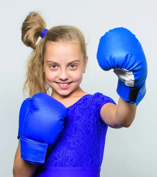 Boxer child workout, healthy fitness. training with coach. Fight. Sport and sportswear fashion. knockout and energy. Sport success. little girl in boxing gloves punching. I am ready to fight.