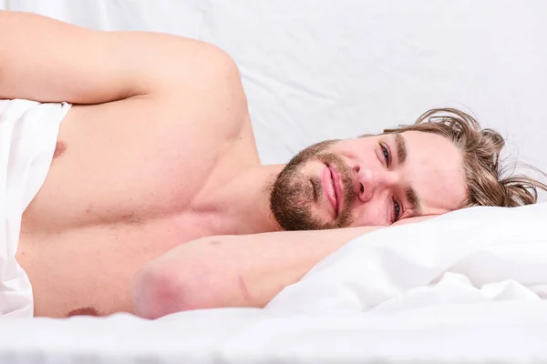 Late morning overslept. Man handsome guy lay in bed in morning. Tips on how to wake up feeling fresh and energetic. Morning routine tips to feel good all day. How to get up in morning feeling fresh — Stock Photo, Image