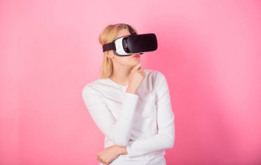 Young woman using a virtual reality headset. Happy woman exploring augmented world, interacting with digital interface. Excited smiling businesswoman wearing virtual reality glasses. clipart
