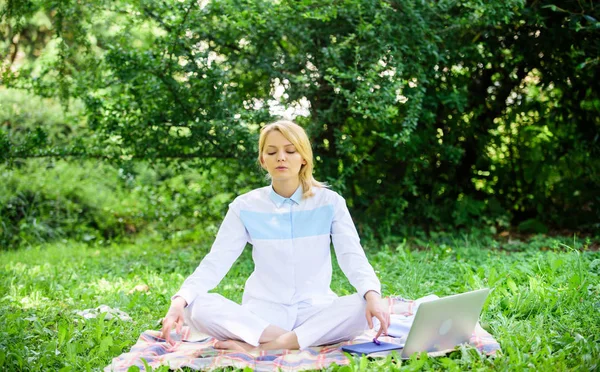 Woman relaxing practicing meditation. Reasons you should meditate every day. Find minute to relax. Clear your mind. Girl meditate on rug green grass meadow nature background. Every day meditation