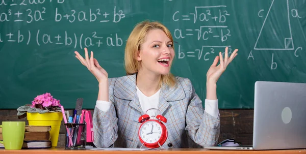 It is time. teacher with alarm clock at blackboard. Time. Back to school. Teachers day. Study and education. Modern school. Knowledge day. School. Home schooling. happy woman. woman in classroom — Stock Photo, Image