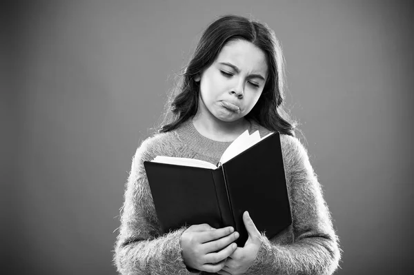 Girl hold book read story over orange background. Child enjoy reading book. Book store concept. Wonderful free childrens books available to read. Childrens literature. Sad ending story — Stock Photo, Image