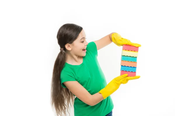 Cleaning supplies. Girl in rubber gloves for cleaning hold many colorful sponges white background. Help clean up. Accessory for cleaning. Housekeeping duties. Wash dishes. Cleaning with sponge Royalty Free Stock Photos