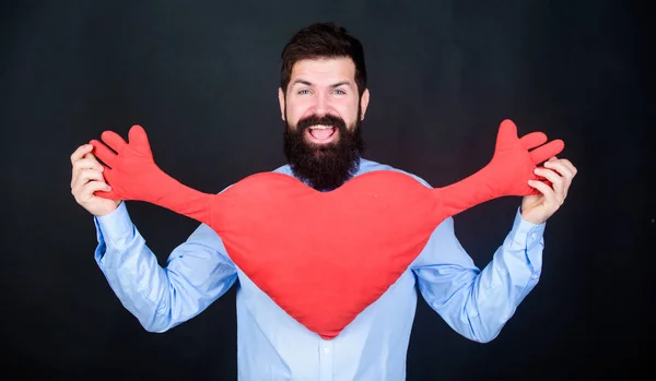 Free hugs. Man bearded hipster hug heart. Celebrate valentines day. Guy with beard and mustache in love romantic mood. Feeling love. Dating and relations concept. Happy in love. Physical touch