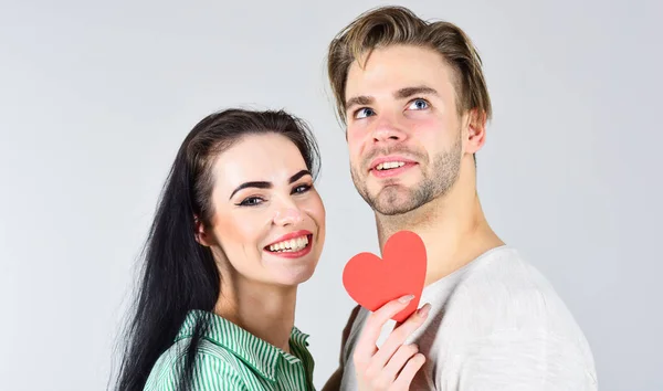 Man and girl in love. Romantic ideas celebrate valentines day. Happy together. Man and woman couple in love hold red paper heart valentines cards. Valentines day and love. Valentines day concept — Stock Photo, Image
