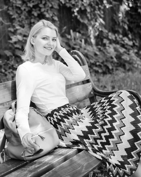 Time for yourself. Why you deserve break. Ways to give yourself break and enjoy leisure. Girl sit bench relaxing in shadow, green nature background. Woman blonde take break relaxing in park