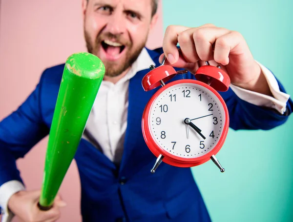 Boss aggressive face hold alarm clock and baseball bat. Man suit hold clock in hand and arguing for being late. Business discipline concept. Time management and discipline. Discipline and sanctions