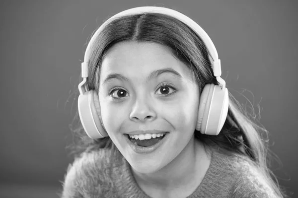 Girl child listen music modern headphones close up. Get music subscription. Access to millions of songs. Enjoy music concept. Best music apps that deserve a listen. Listen for free