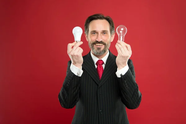 I got it. Man with beard search for inspiration. Lamp. Electricity and energy. Mature bearded man with lamp. Businessman in suit hold light bulb. Power saving. Business startup. In search of new idea — Stock Photo, Image