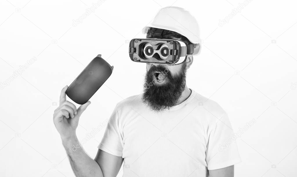 The man with glasses of virtual reality. Portrait of an amazed guy using a virtual reality headset isolated on white background. Future is right now.