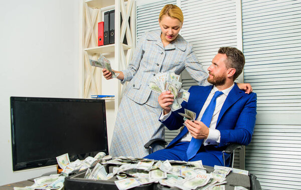 Counting money profit. Man businessman and woman secretary with pile dollar banknotes. Profit and richness concept. Businessman near cash dollars profit. Huge profit concept. Financial success