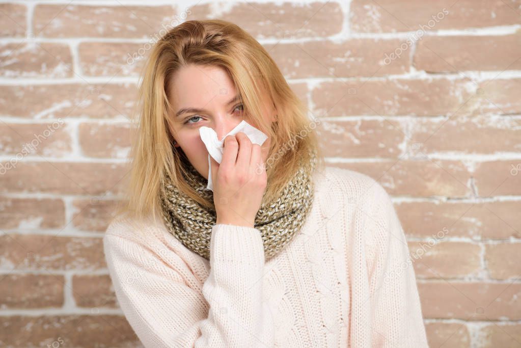 Sneezing just keep coming. Sick woman blowing her nose in napkin. Pretty girl sneezing of seasonal influenza virus. Cute woman caught nasal cold or allergic rhinitis. Suffering from flu or allergy