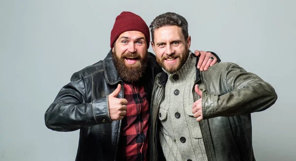 Brutal bearded men wear leather jackets. Real men and brotherhood. Friends glad see each other. Friendly relations. Friendship of brutal guys. Real friendship mature friends. Male friendship concept — Stock Photo, Image