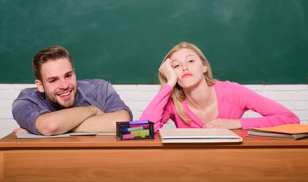 Studying in college or university. Apply for free program. Couple friends student studying university. Student life issues. Guy and girl tired or lazy student lean on desk in classroom. Feeling bored — Stock Photo, Image