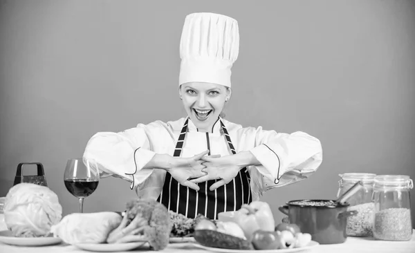 Fresh vegetables ingredients for cooking meal. Lets start cooking. Woman chef cooking healthy food. Gourmet main dish recipes. Delicious recipe concept. Girl in hat and apron. Cooking healthy food