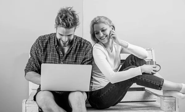 Surfing web together. Couple cheerful spend leisure with laptop surfing web watch video. Couple in love relaxing surfing internet for fun. Family leisure. Modern young people leisure internet surfing