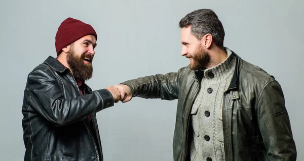 Real friendship mature friends. Male friendship concept. Brutal bearded men wear leather jackets. Real men and brotherhood. Friends glad see each other. Friendly relations. Friendship of brutal guys