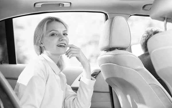 Business life concept. Business woman sit on backseat. Busy lady passenger leather car salon enjoy journey with chauffeur. Business lady passenger luxury car salon. Personal assistant and driver — Stock Photo, Image