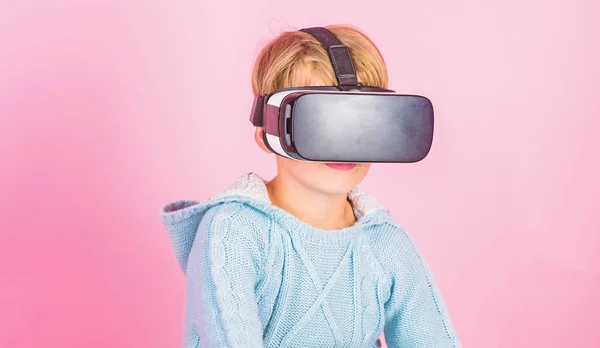 Virtual reality future technology. Discover virtual reality. Kid boy wear vr glasses pink background. Child boy play virtual reality game. Explore alternative reality. Cyber space and virtual gaming