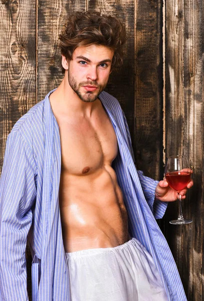 Guy attractive relaxing with alcohol drink. Man sexy chest sweaty skin hold wineglass. Macho tousled hair degustate luxury wine. Drink wine and relax. Erotic and desire concept. Bachelor enjoy wine