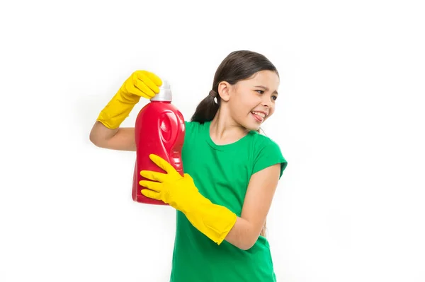 A washing day. Little child ready for household laundering. Small child holding laundry detergent in hands. Using household cleaning product. Adorable little cleaner wearing yellow rubber gloves — Stock Photo, Image