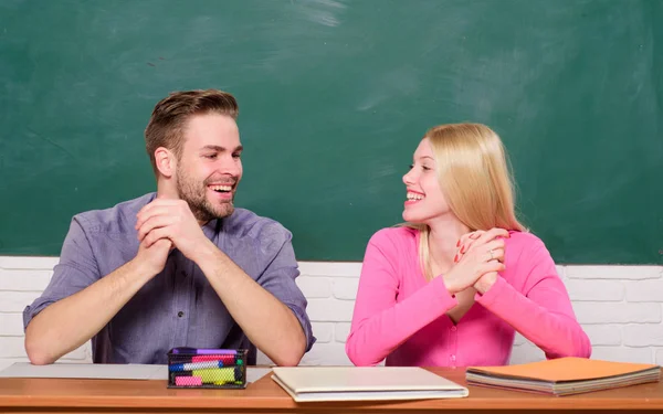 Library romance. Happy couple. Student life. Lesson and blackboard. Teachers day. Couple of man and woman in classroom. Home schooling. Modern school. Knowledge day. Back to school — Stock Photo, Image