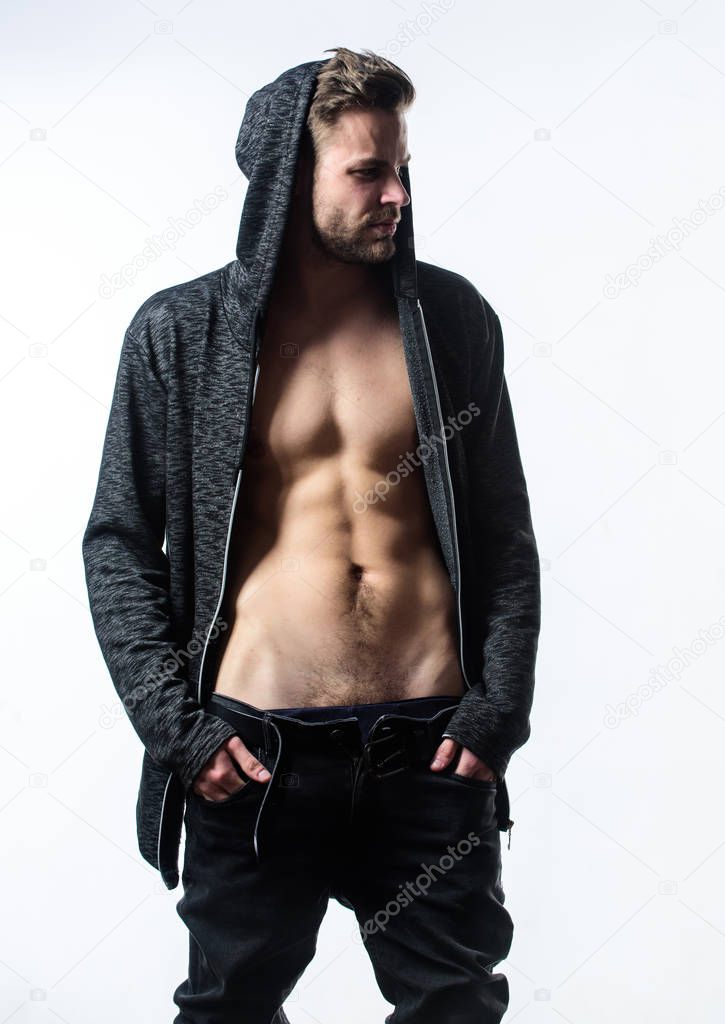 Confident in his attractiveness. Time change clothes. Man handsome sexy undressing. Hipster sexy muscular torso take off clothes. Seductive macho feeling sexy. Unleashed desire. Attractive sexy body