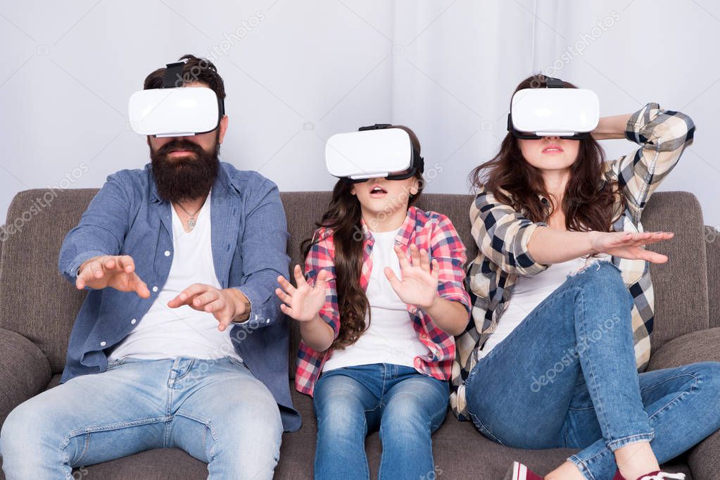 Live Life Your Way. Creating Memories. Virtual reality. vr love. vr family. Happy family in vr glasses. Bearded man and woman with little girl. surprised little girl child with mother and father