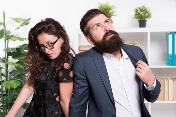 Tired man with beard and sexy woman. Young coworkers. Businesspeople. Teamwork. Business couple in office. Formal fashion dress code. Overtime. Tired from work. Tired office worker. feeling tired