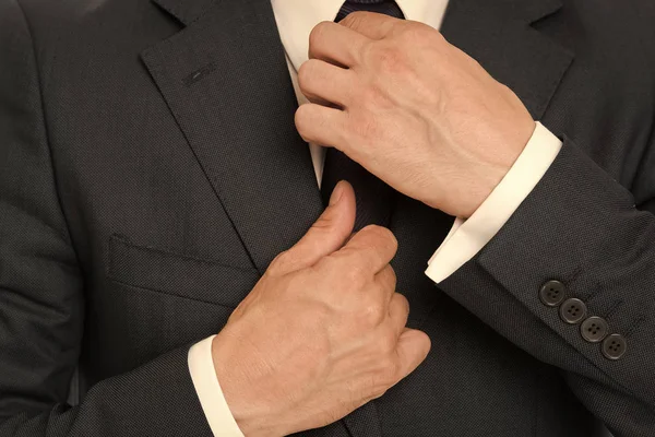 Perfect to the last detail. Stylish details business appearance. Business style dress code. Male hands fixing tie business style outfit. Confident in his style. Business people choose formal clothing