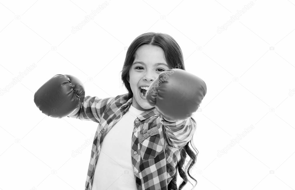 Girl power and feminism concept. Happy kid boxing in gloves isolated on white. Child boxer with long hair boxing for fun. Sport activity and fun leisure. Boxing skill practice. Feminist upbringing