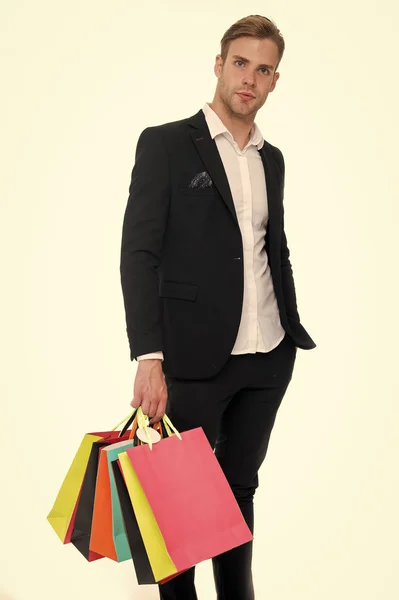 Man stylist professional shopper. Shop consultant helps carries bunch shopping bags. Clothes consultant. Stylist buy fashionable clothes client. Shopping service concept. Man formal suit shopping