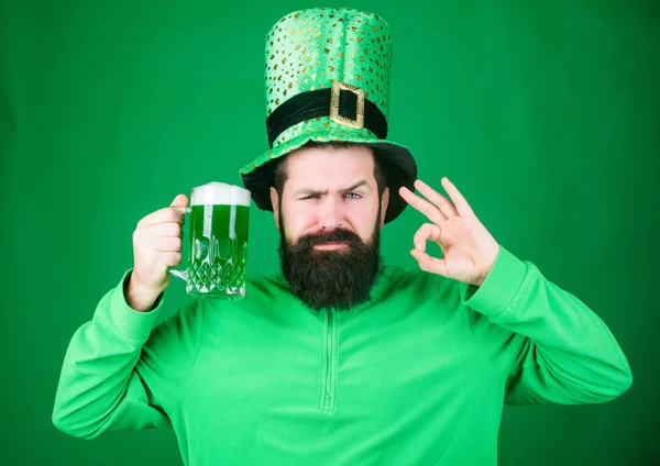 Patricks day party. Alcohol beverage. Symbol of Ireland. Man bearded hipster drink beer. Irish pub. Highly recommend. Drinking beer celebration. Fest and holiday menu. Dyed green traditional beer