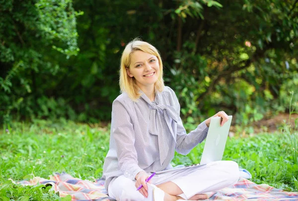 Business lady freelance work outdoors. Online or freelance career ideas concept. Guide starting freelance career. Woman with laptop sit on rug grass meadow. Steps to start freelance business