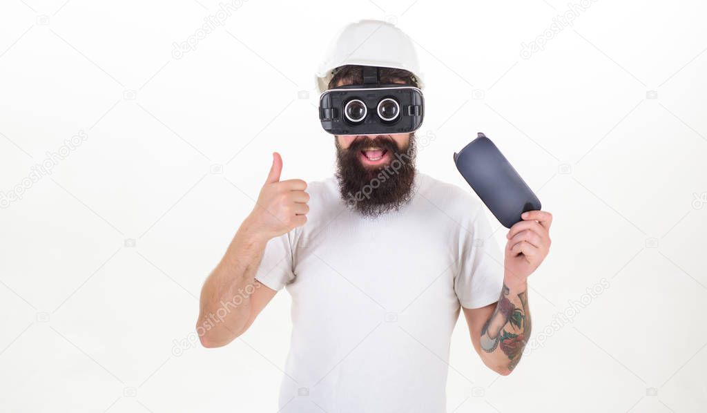 Man wearing virtual reality goggles in white background. Happy bearded man wearing virtual reality goggles watching movies or playing video games. Virtuality glasses.