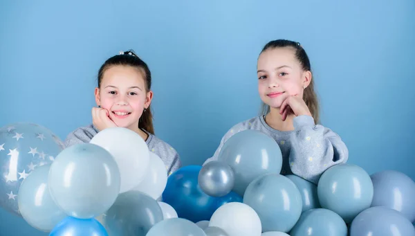 Sisters organize home party. Having fun concept. Balloon theme party. Girls best friends near air balloons. Start this party. Birthday party. Happiness and cheerful moments. Carefree childhood