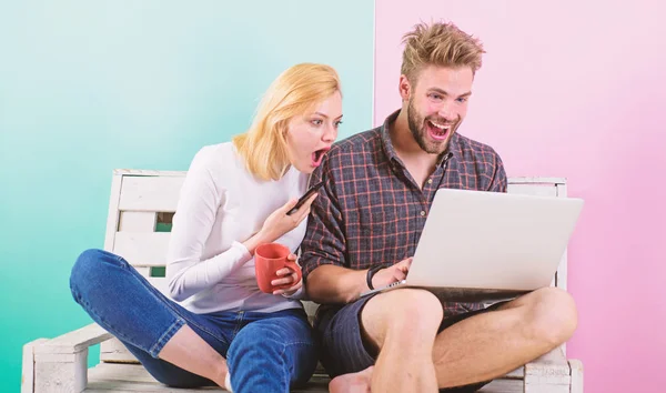 Modern occupation. Shocking content. Man girl create content blog social network. Couple surfing internet posting content social network. Couple content creators work with laptop and smartphone — Stock Photo, Image