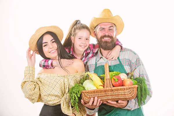 Family farmers gardeners vegetables harvest isolated white background. Family rustic farmers proud of fall harvest. Grown with love. Parents and daughter celebrate harvest. Harvest festival concept