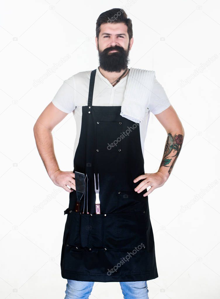 Roasting and grilling food. Tips cooking meat. Tools for roasting meat outdoors. Picnic and barbecue. How choose meat for steak and barbecue. Barbecue menu. Bearded hipster wear apron for barbecue