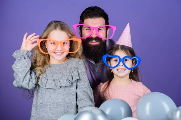 Fancy party. Family of father and daughters wearing party goggles. Family party. Happy family celebrating birthday party. Father and girl children enjoying time together. Having a family celebration