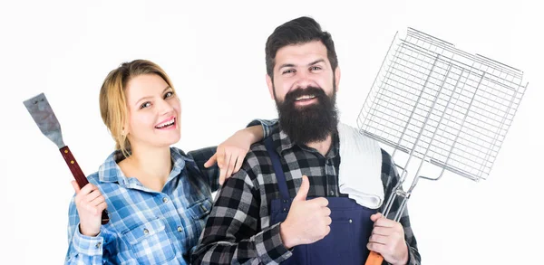 We are better when we together. Family weekend. Man bearded hipster and girl. Preparation and culinary. Couple in love hold kitchen utensils. Tools for roasting meat. Picnic barbecue. food cooking — Stock Photo, Image