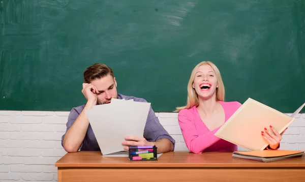 Apply for free program. Couple friends students studying university. Guy and girl sit at desk in classroom. Correct answer on their mind. Enjoying university life. Studying in college or university — Stock Photo, Image