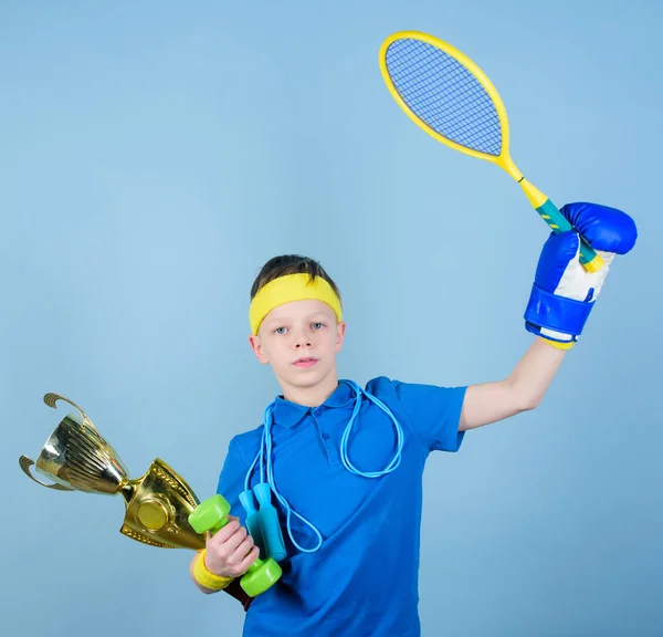 Success in sport. Succeed in everything. Athlete successful boy sport equipment jump rope boxing glove tennis racket roller skate and golden goblet. Success and award. Proud of achieved success
