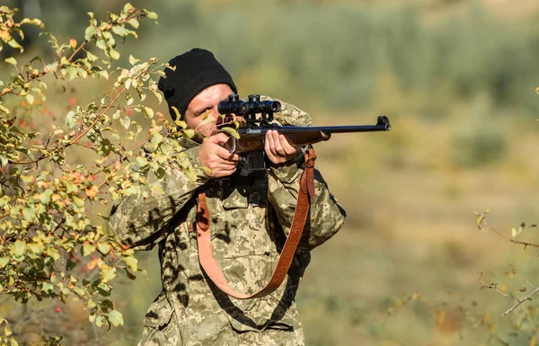 Hunting skills and weapon equipment. How turn hunting into hobby. Bearded man hunter. Army forces. Camouflage. Military uniform fashion. Man hunter with rifle gun. Boot camp. defender of Motherland — Stock Image Hunting skills and weapon equipment. How turn hunting into hobby. Bearded man hunter. Army forces. Camouflage. Military uniform fashion. Man hunter with rifle gun. Boot camp. defender of Motherland Royalty Free Stock Images