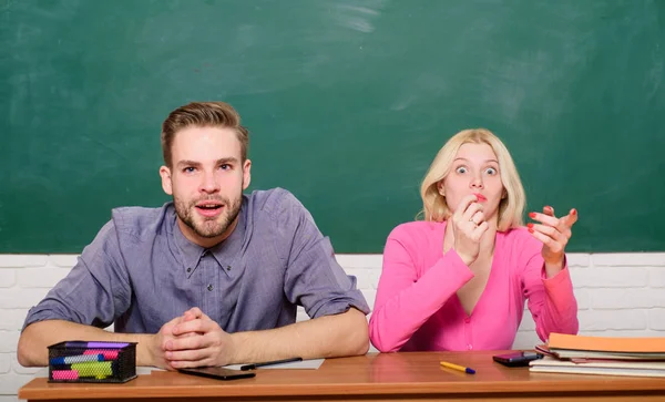 Guy and girl sit at desk in classroom. Wondering about result. Studying in college or university. Couple friends students studying university. Surprising answer. Studying hard. How is it possible — Stock Photo, Image