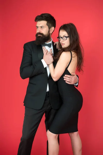 Bearded man wear suit girl elegant dress. Formal dress code. Visiting event or ceremony. Couple ready for award ceremony. Corporate party. Award ceremony concept. Elegance is not about being noticed