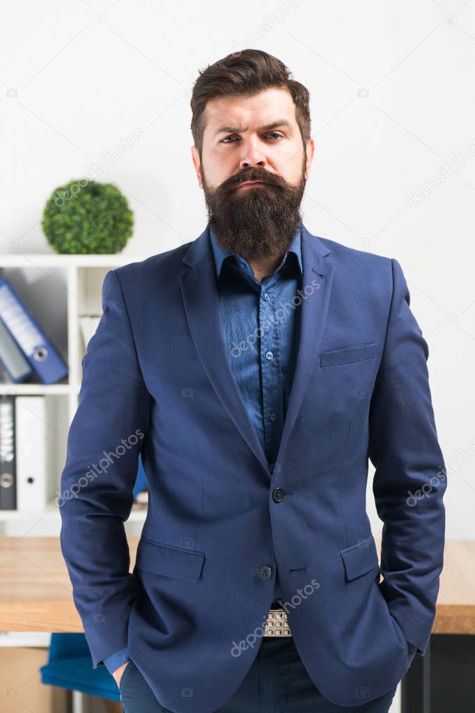 Bearded man boss. Mature hipster with beard. Confident brutal man boss. Business. Modern businessman. Businessman in formal suit. Serious man. Male fashion in business office. Boss and employee