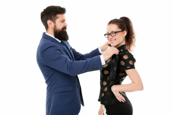 Last detail. Business relations. Help each other look perfect. Business partners man and woman adjust outfit before business conference or meeting. Boss and attractive lady assistant white background