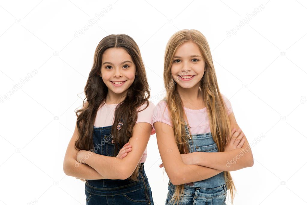 Loose haired but elegant. Kids hair care and grooming. Cute little girls wearing new hairstyle. Adorable small girls with long hairstyle. Beauty and hair salon. Natural hair styling and dressing