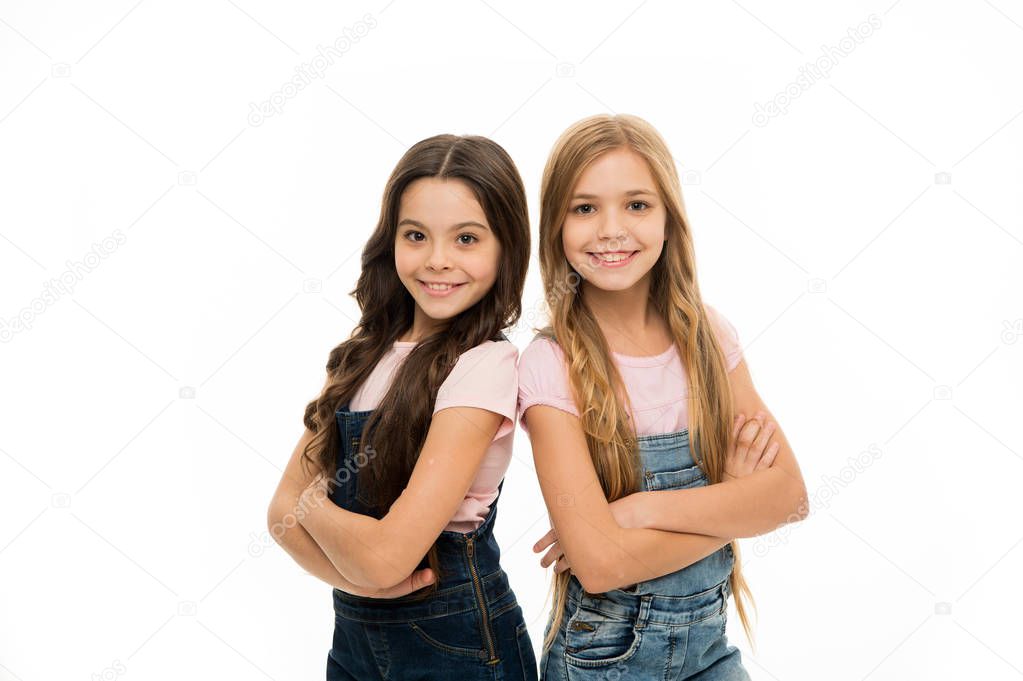 Hair like this is the focus of their look. Beauty and hair salon. Cute little girls wearing new hairstyle. Small girls with long hairstyle. Kids hair grooming. Natural hair styling and dressing